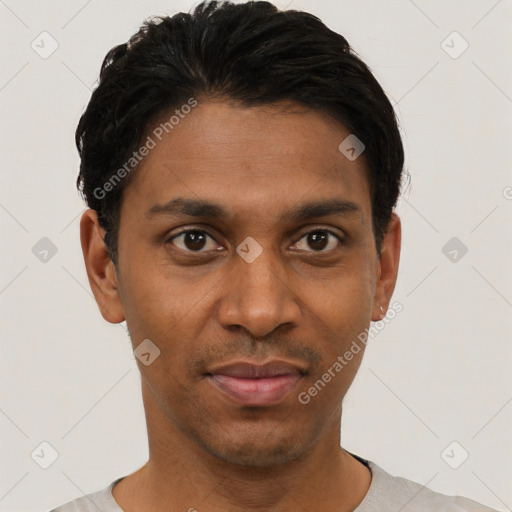 Joyful black young-adult male with short  black hair and brown eyes