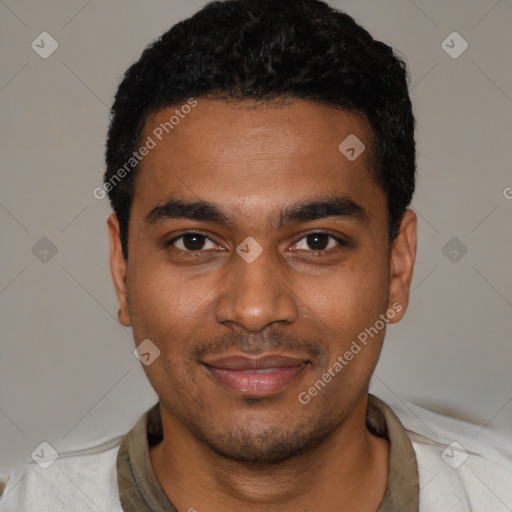 Joyful black young-adult male with short  black hair and brown eyes