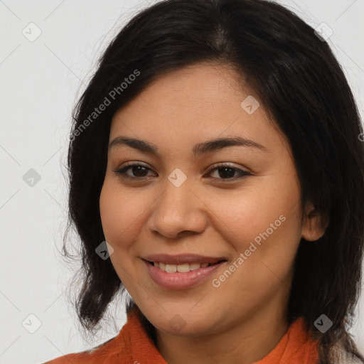 Joyful latino young-adult female with medium  brown hair and brown eyes