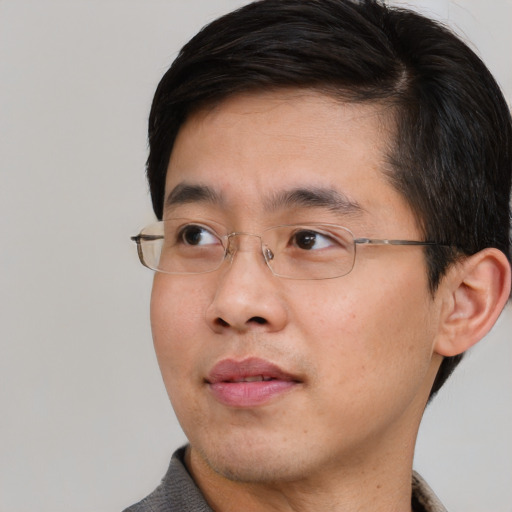 Neutral asian young-adult male with short  brown hair and brown eyes