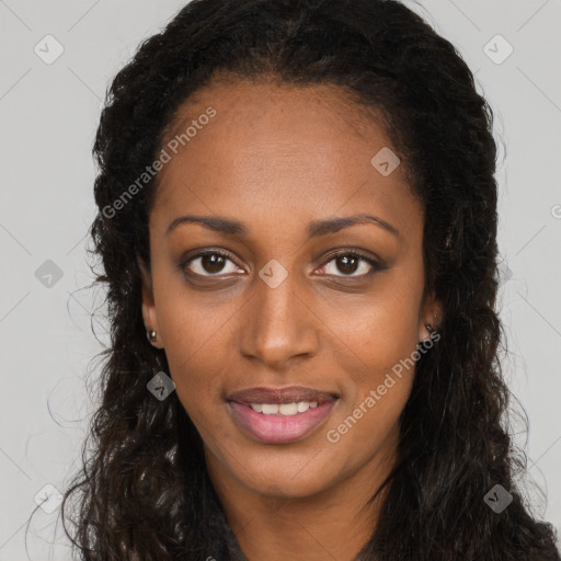 Joyful black young-adult female with long  brown hair and brown eyes