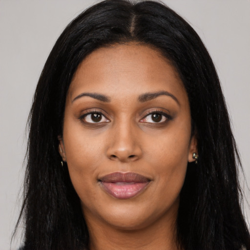 Joyful asian young-adult female with long  black hair and brown eyes