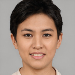 Joyful asian young-adult female with short  brown hair and brown eyes