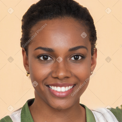 Joyful black young-adult female with short  black hair and brown eyes