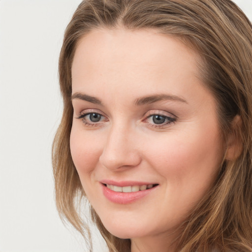 Joyful white young-adult female with long  brown hair and grey eyes