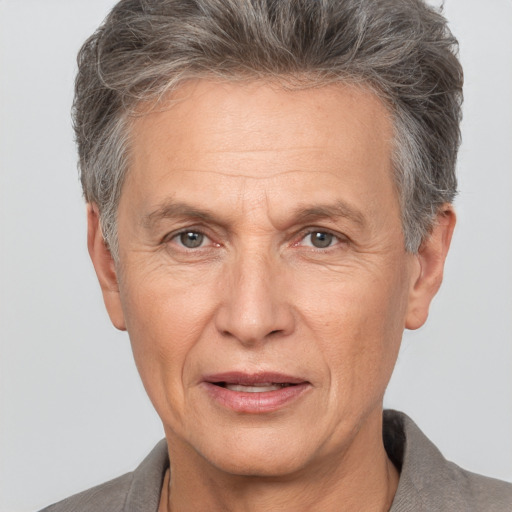 Joyful white middle-aged male with short  brown hair and brown eyes