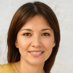 Joyful white young-adult female with medium  brown hair and brown eyes