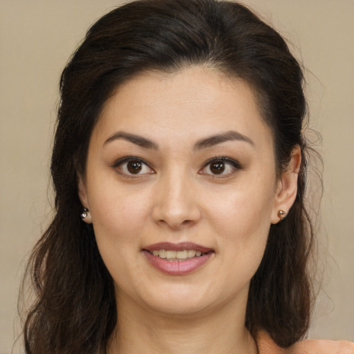 Joyful latino young-adult female with medium  brown hair and brown eyes