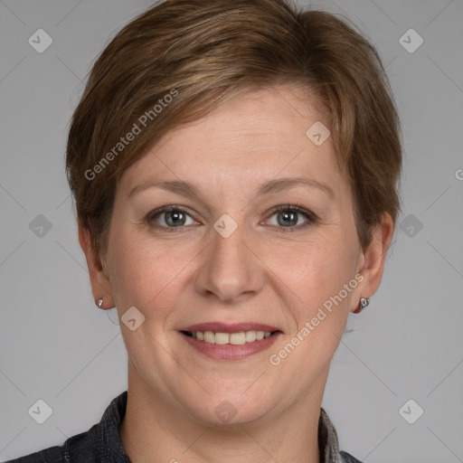 Joyful white adult female with medium  brown hair and grey eyes