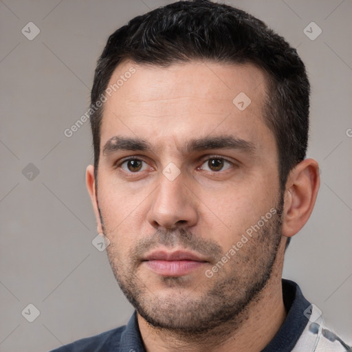 Neutral white young-adult male with short  black hair and brown eyes