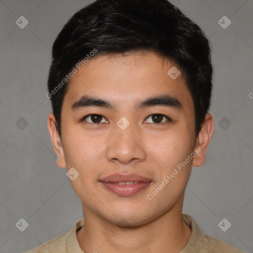 Joyful asian young-adult male with short  brown hair and brown eyes