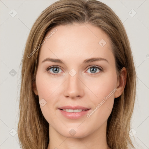 Joyful white young-adult female with long  brown hair and green eyes