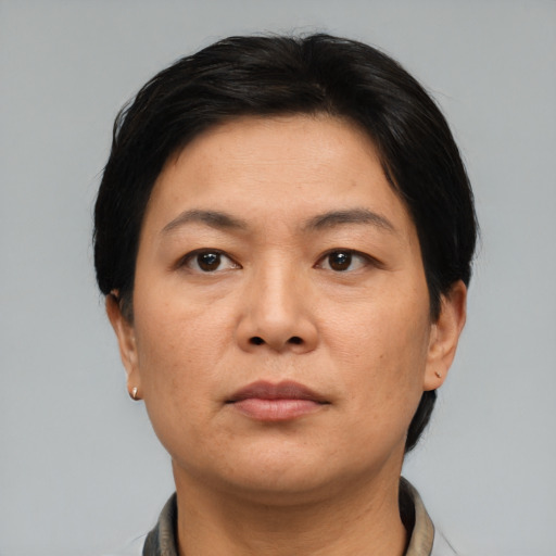 Neutral asian adult female with short  black hair and brown eyes