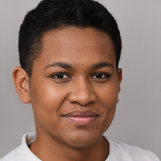 Joyful black young-adult female with short  brown hair and brown eyes