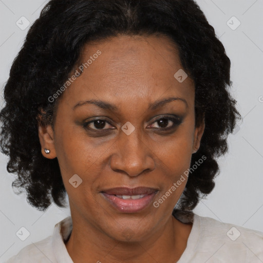 Joyful black adult female with short  brown hair and brown eyes