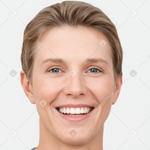 Joyful white young-adult female with short  brown hair and grey eyes