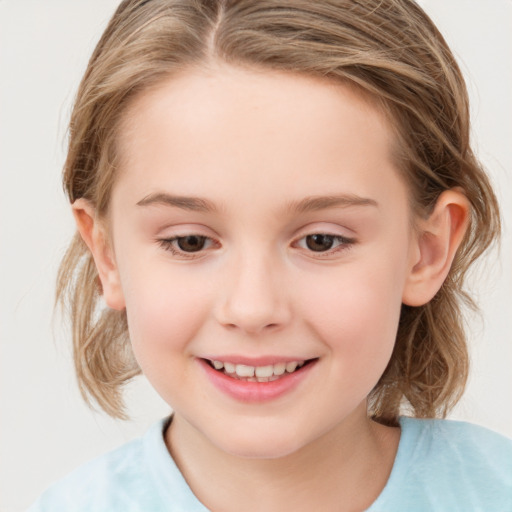 Joyful white child female with medium  brown hair and grey eyes