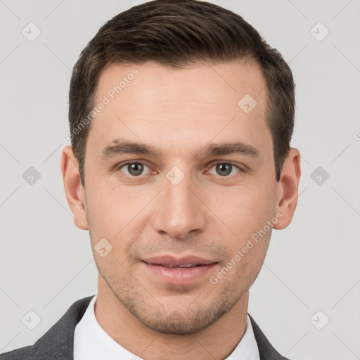 Joyful white young-adult male with short  brown hair and brown eyes