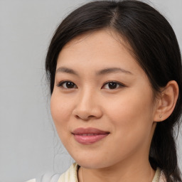 Joyful asian young-adult female with medium  brown hair and brown eyes