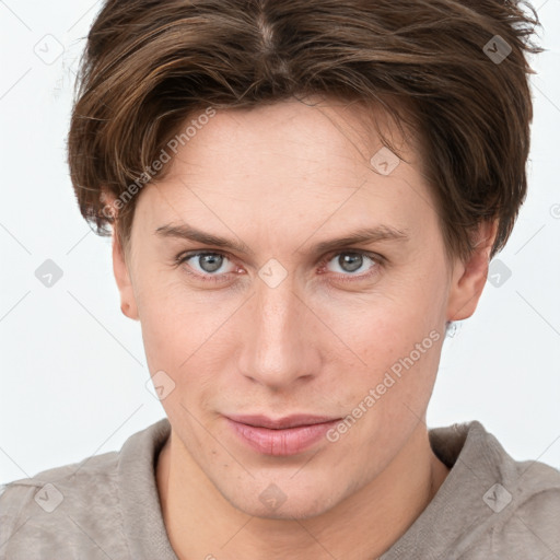 Joyful white young-adult female with short  brown hair and grey eyes