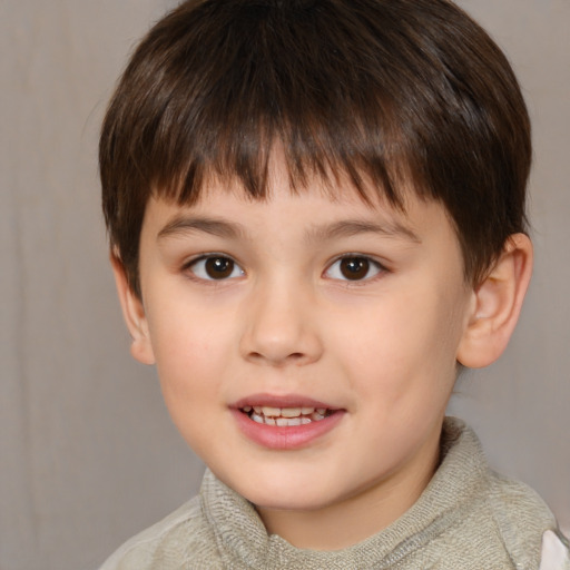 Joyful white child male with short  brown hair and brown eyes