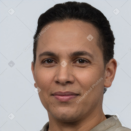 Joyful white adult male with short  black hair and brown eyes