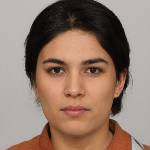 Neutral white young-adult female with medium  black hair and brown eyes