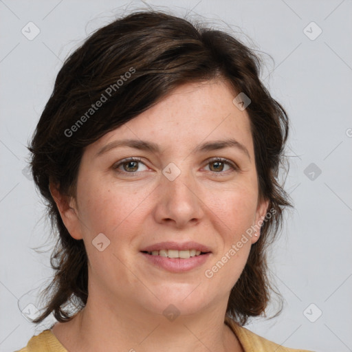 Joyful white adult female with medium  brown hair and brown eyes