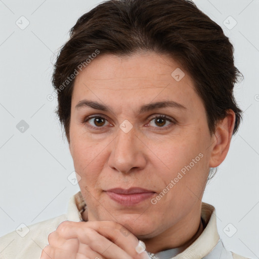 Joyful white adult female with short  brown hair and brown eyes