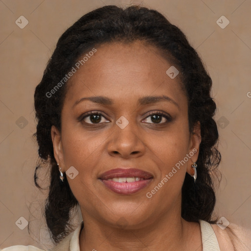 Joyful black adult female with medium  brown hair and brown eyes