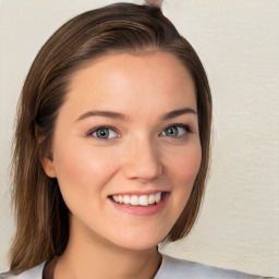 Joyful white young-adult female with long  brown hair and blue eyes