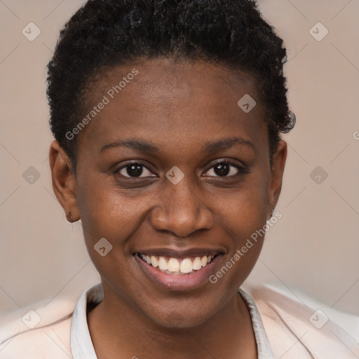 Joyful black young-adult female with short  brown hair and brown eyes