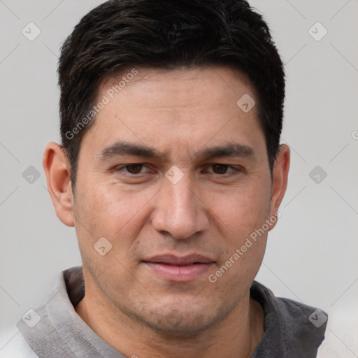 Joyful white adult male with short  brown hair and brown eyes