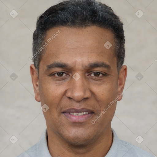 Joyful white adult male with short  black hair and brown eyes