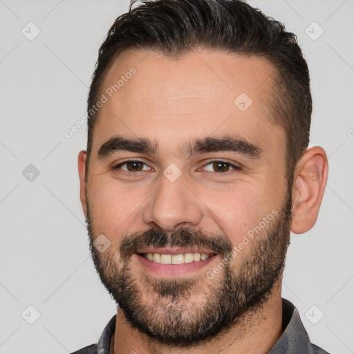 Joyful white young-adult male with short  brown hair and brown eyes