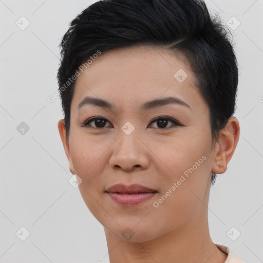 Joyful asian young-adult female with short  black hair and brown eyes