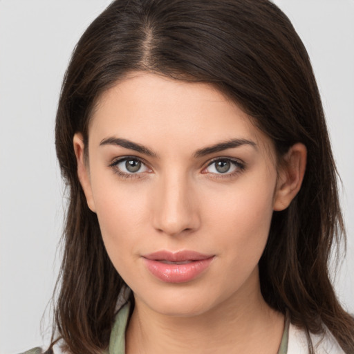 Neutral white young-adult female with medium  brown hair and brown eyes