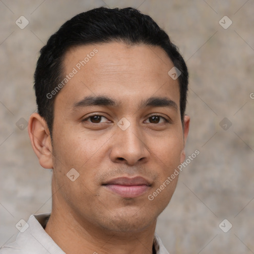 Joyful latino young-adult male with short  brown hair and brown eyes