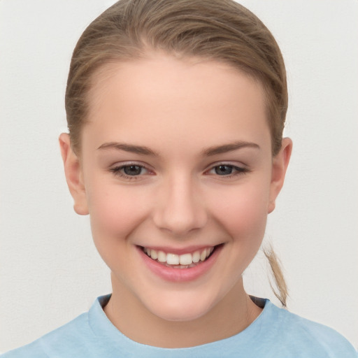 Joyful white child female with medium  brown hair and brown eyes