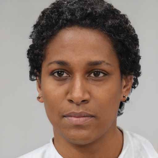 Neutral black young-adult female with short  brown hair and brown eyes