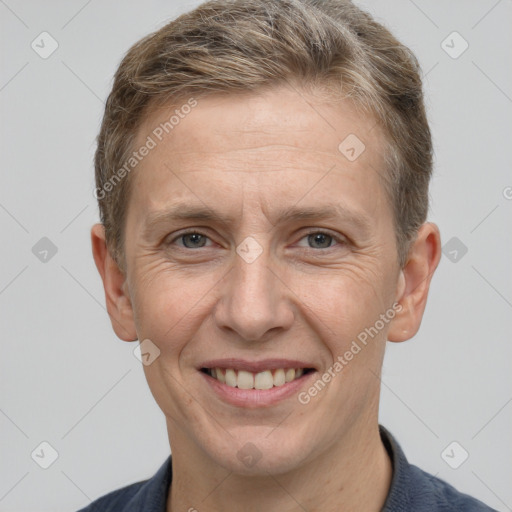 Joyful white adult male with short  brown hair and grey eyes