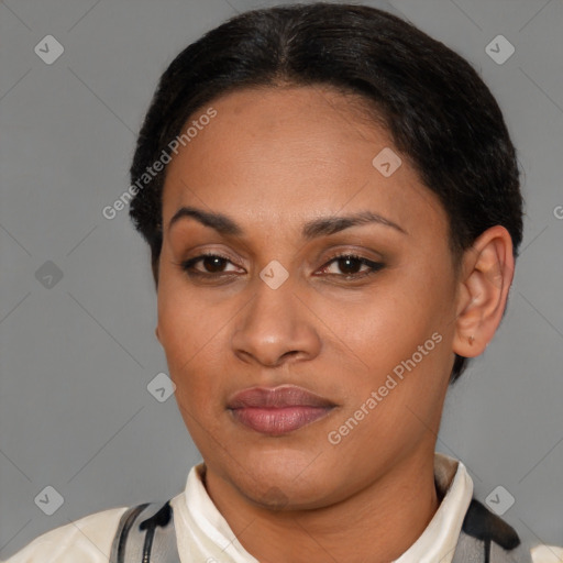 Joyful latino young-adult female with short  brown hair and brown eyes