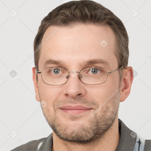 Joyful white adult male with short  brown hair and grey eyes