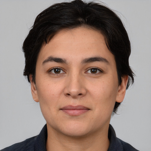 Joyful white young-adult female with medium  black hair and brown eyes