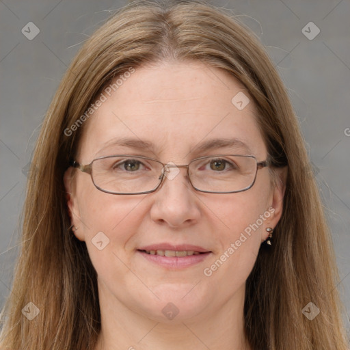 Joyful white adult female with long  brown hair and grey eyes