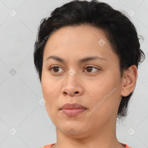 Joyful asian young-adult female with short  brown hair and brown eyes