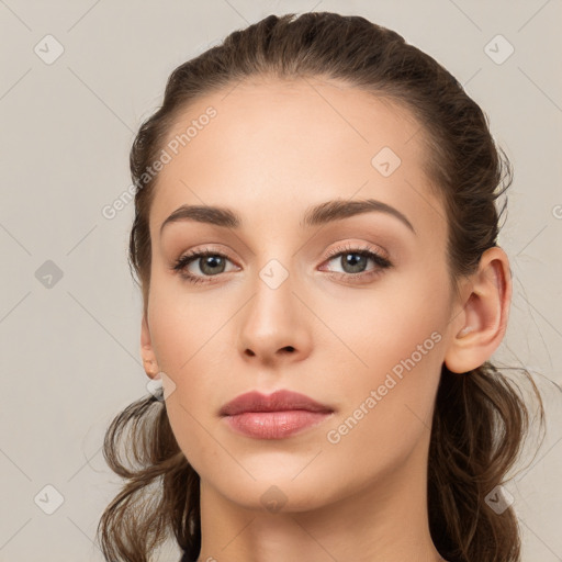 Neutral white young-adult female with long  brown hair and brown eyes