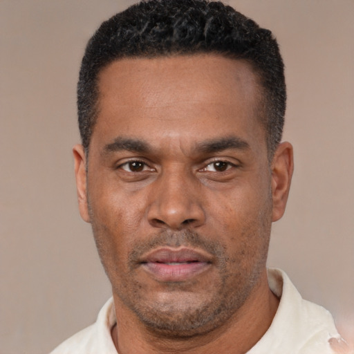 Neutral latino adult male with short  black hair and brown eyes