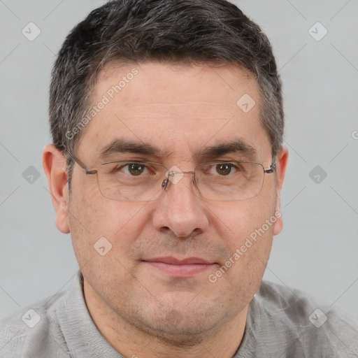 Joyful white adult male with short  brown hair and brown eyes