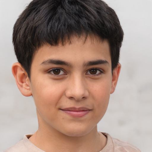 Joyful white child male with short  brown hair and brown eyes